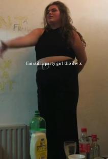 Woman in black top and pants says 
