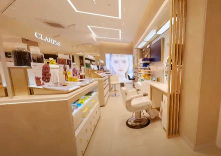 Interior view of a Clarins and Lancôme beauty counter.