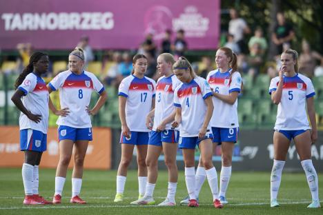 England's under-19 women's football team on the field.