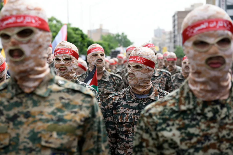 Military personnel wearing camouflage uniforms and balaclavas.