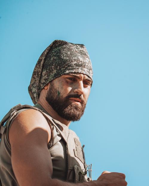 Close-up of Josko Gvardiol in military attire.
