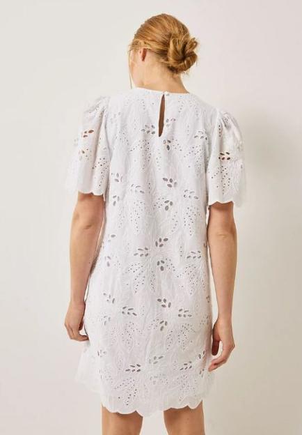 White eyelet dress viewed from the back.