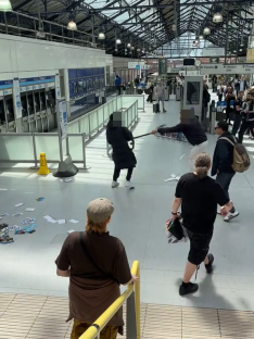 Chaos at Earls Court Station; a man fights off a thief attempting to steal his watch.