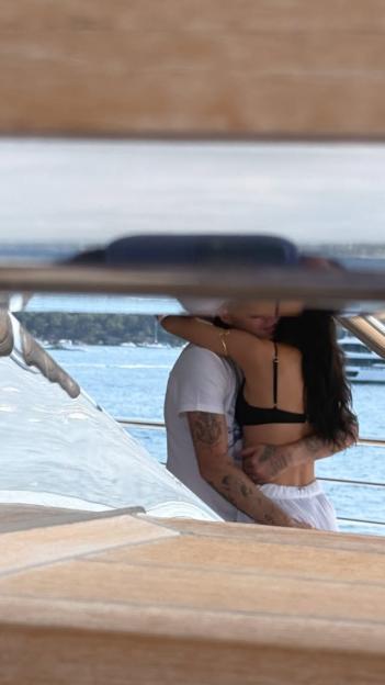 Couple embracing on a boat.