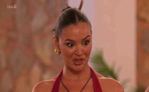 Screenshot of a woman from Love Island looking surprised.