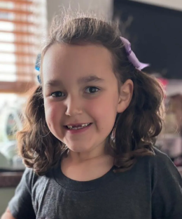 Portrait of a young girl smiling.