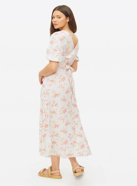 Woman in a floral midi dress.