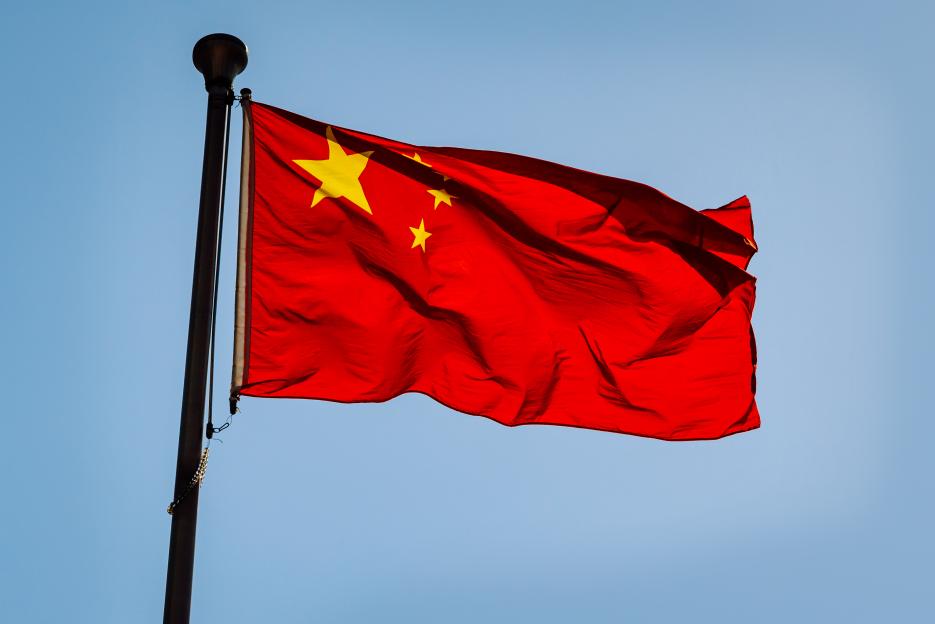 Chinese flag waving in the wind.