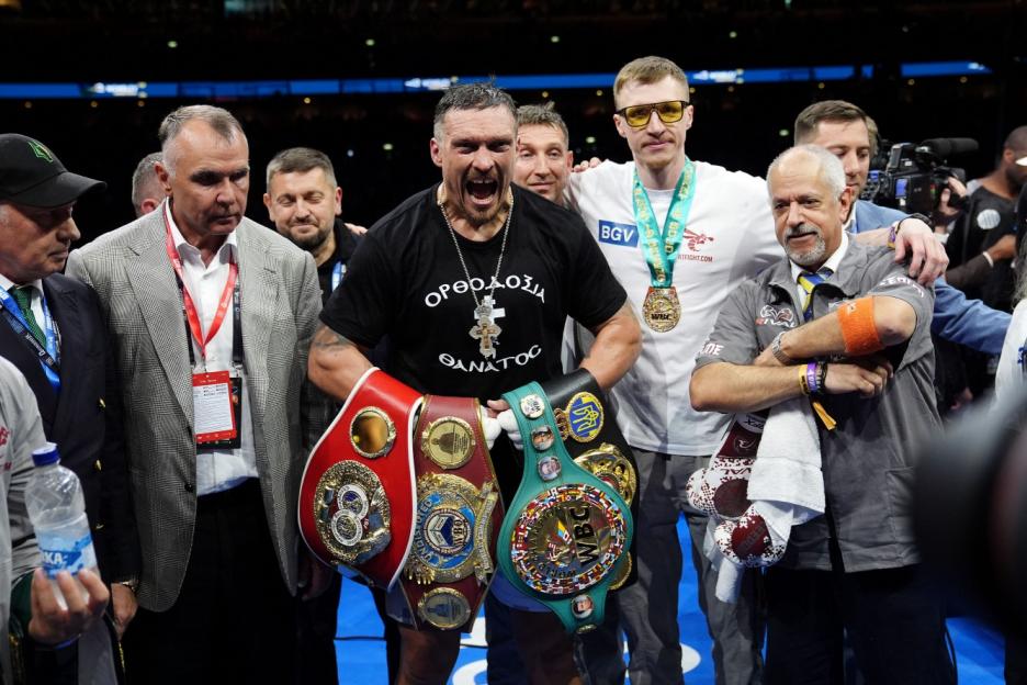 Oleksandr Usyk celebrates winning their IBF, IBO, WBC and WBO World heavyweight bout against Daniel Dubois at Wembley Stadium, London. Picture date: Saturday July 19, 2025. PA Photo. Photo credit should read: Bradley Collyer/PA Wire. RESTRICTIONS: Use subject to restrictions. Editorial use only, no commercial use without prior consent from rights holder.