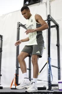 Kylian Mbappé of Real Madrid exercising in a gym.