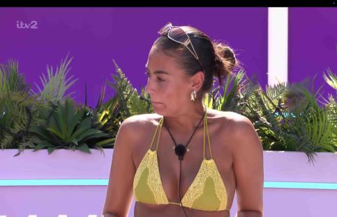Love Island contestant in a yellow bikini.