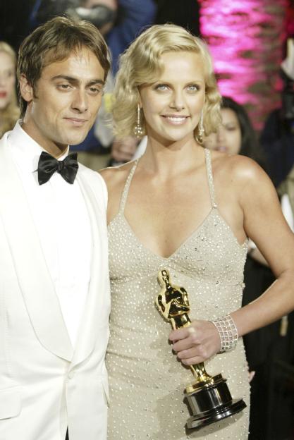 Charlize Theron and her fiancÃ© at an awards ceremony.