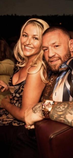 Conor McGregor with a woman in a nightclub.