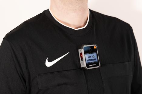 Referee wearing a body camera.