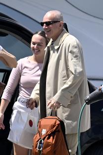 Daniel Day-Lewis and Rebecca Miller arriving by van and boarding a speedboat.