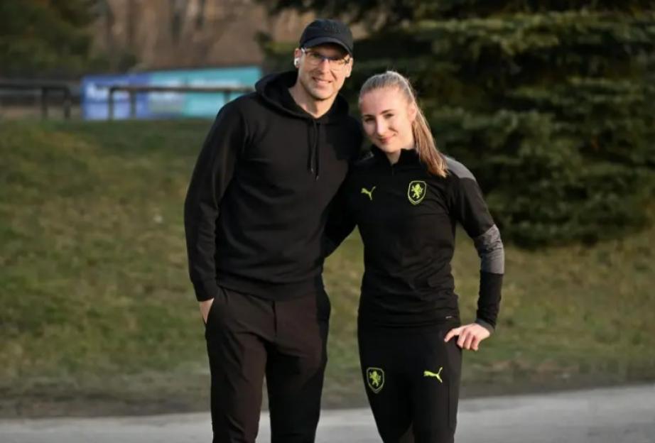 Man and woman in black athletic wear.