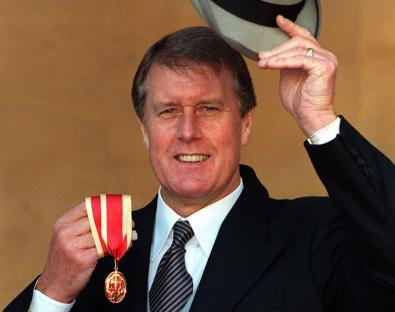 Sir Geoff Hurst, knighted for services to Association Football, holding his medal and top hat.