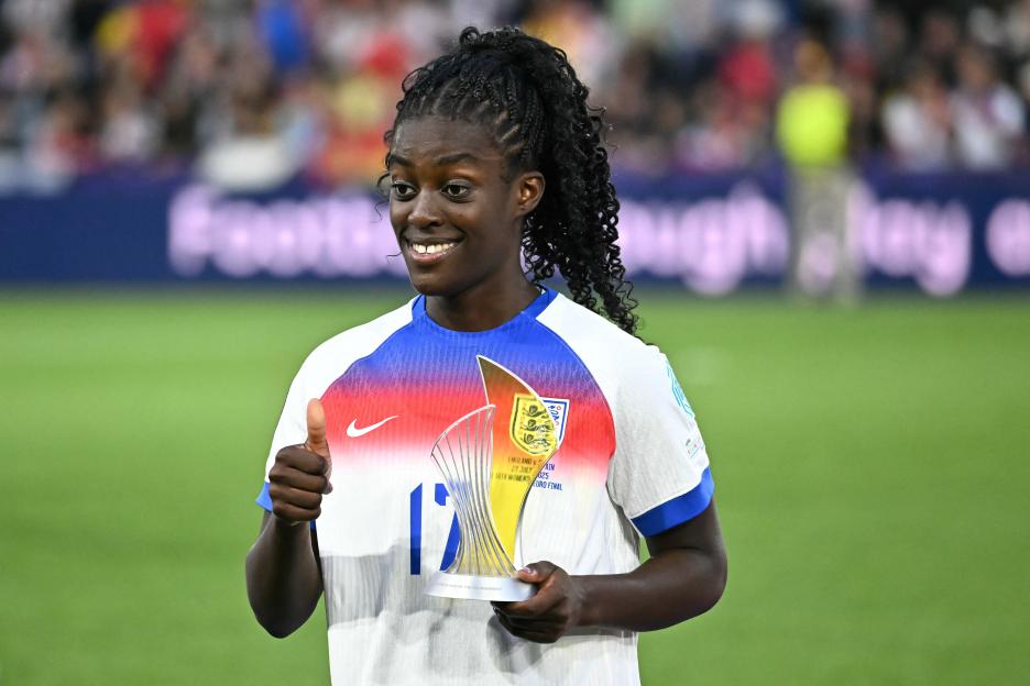 Michelle Agyemang, England's #17, holding the Young Player of the Tournament trophy.