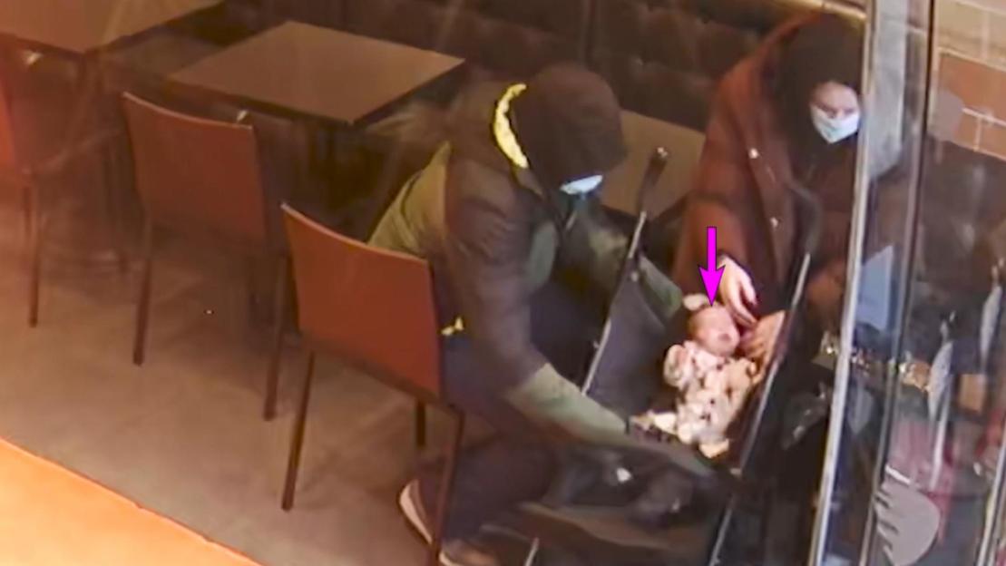 Surveillance image of Constance Marten and Mark Gordon with their baby in a restaurant.