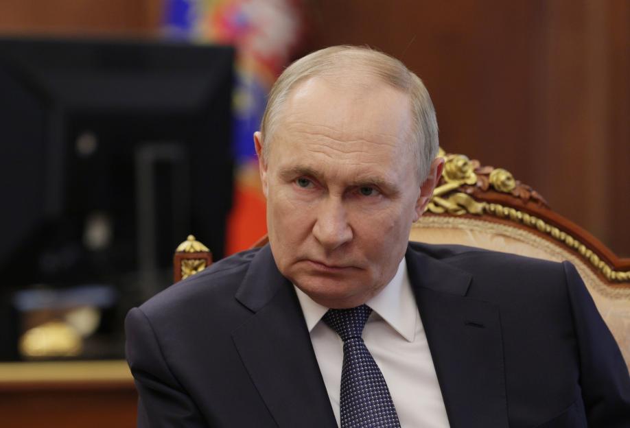 Vladimir Putin at a meeting in the Kremlin.
