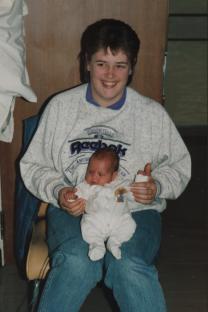 Beverley Allitt holding baby Katie Phillips.