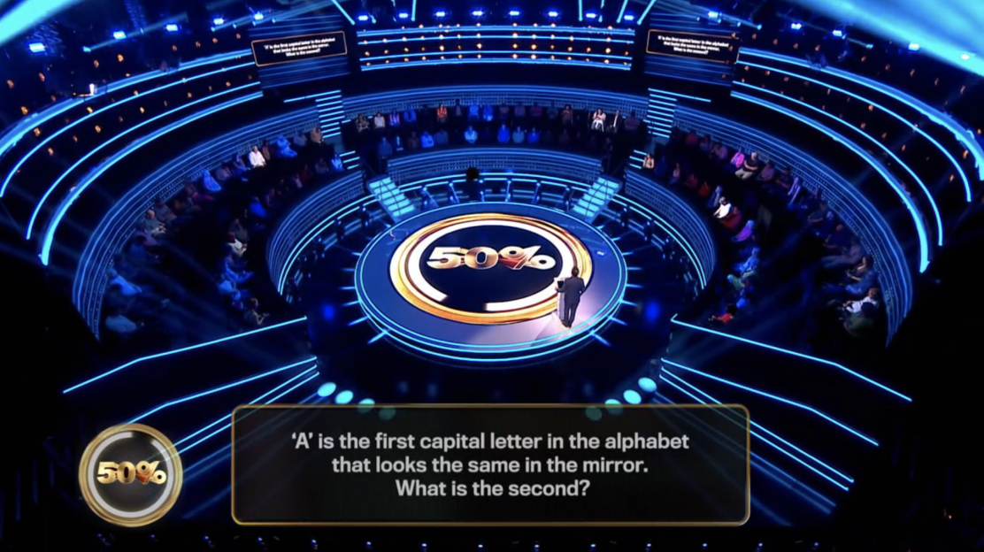 Game show set with audience and question: