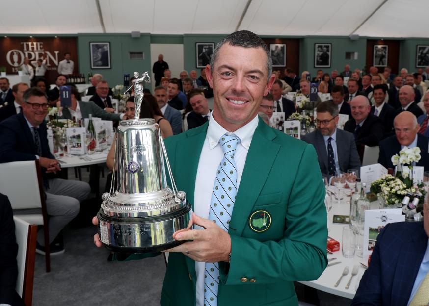 Rory McIlroy holding the 2024 Golfer of the Year award.