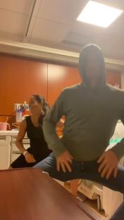 Meghan Markle and Prince Harry dancing in a hospital room.
