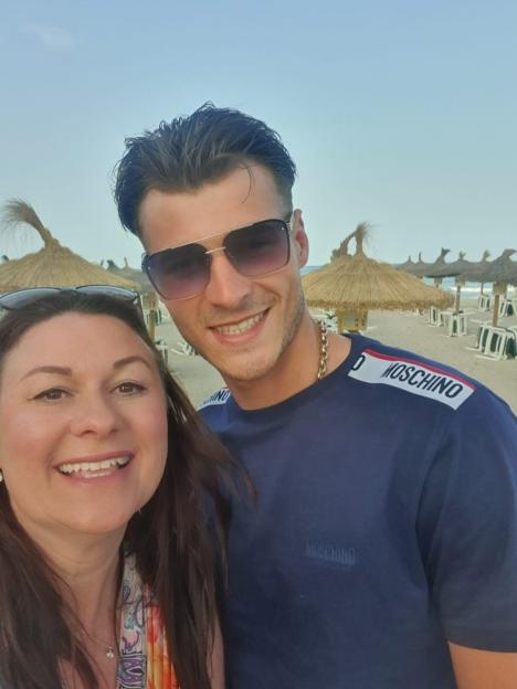 Blue Stevens and his mother on a beach.