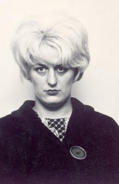 Black and white mugshot of Myra Hindley.