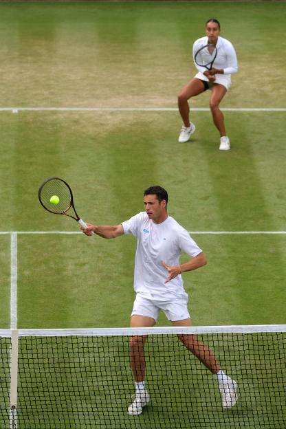 Joshua Paris of Great Britain playing tennis.