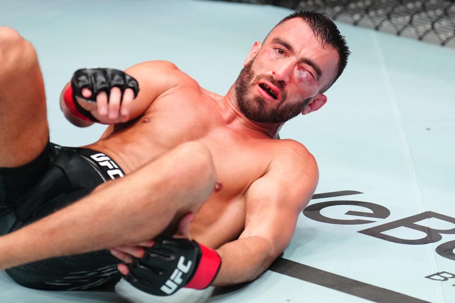 Mohammad Yahya, injured and on the ground during a UFC fight.