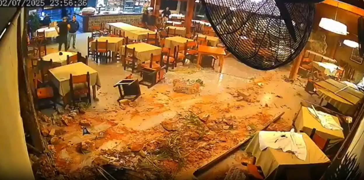 Restaurant interior damaged with debris on the floor.