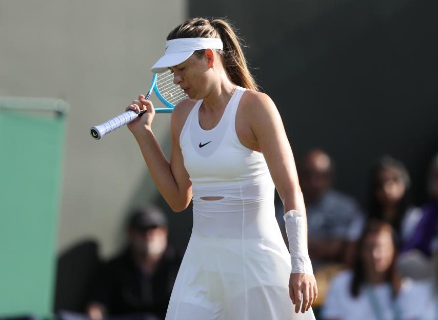 Maria Sharapova playing tennis.