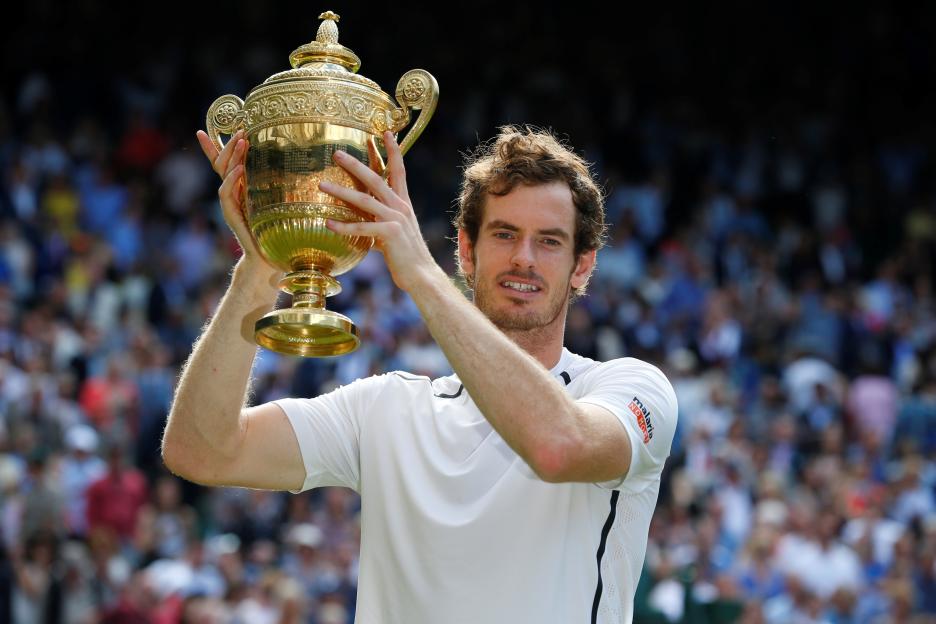 Andy Murray holding the Wimbledon championship trophy.