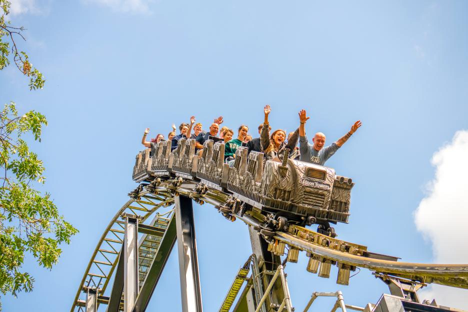 People enjoying a rollercoaster ride.