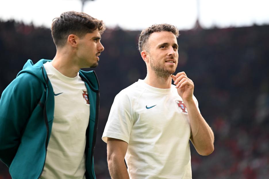 Pedro Neto and Diogo Jota of the Portugal national team inspecting the pitch.