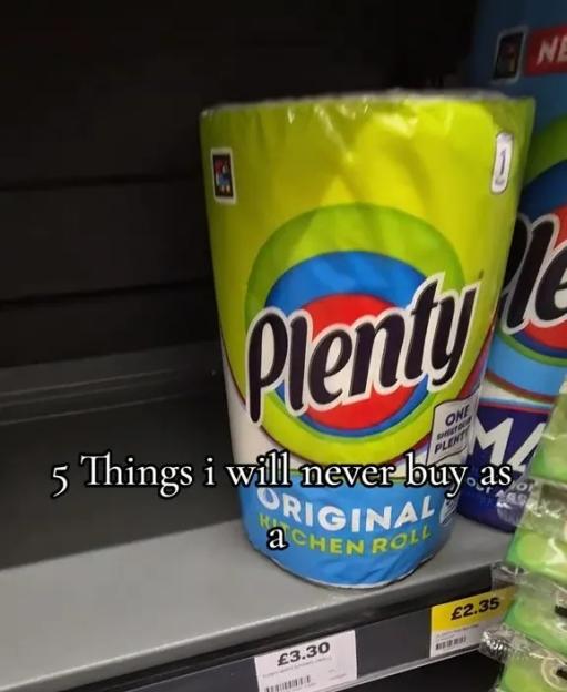A roll of Plenty kitchen paper on a supermarket shelf.