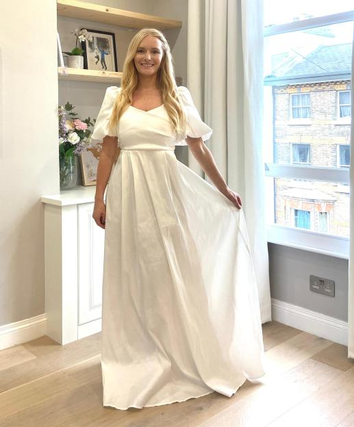 Woman in a white maxi dress.