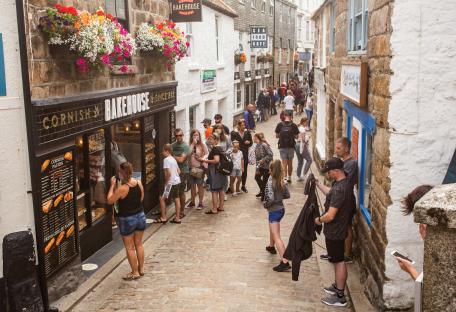 Tourists queueing outside a Cornish bakery in St Ives.