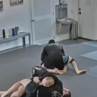 Jiu-jitsu student on the ground during a training session.