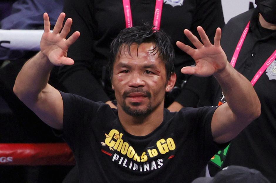 Manny Pacquiao gestures to fans after a boxing match.