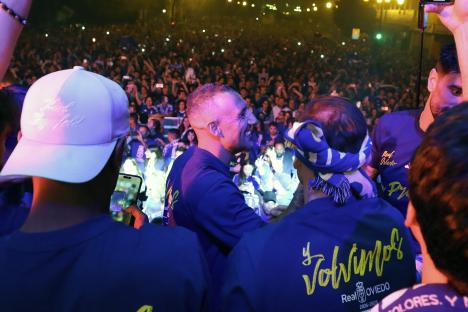 Real Oviedo players celebrate their return to La Liga with fans.