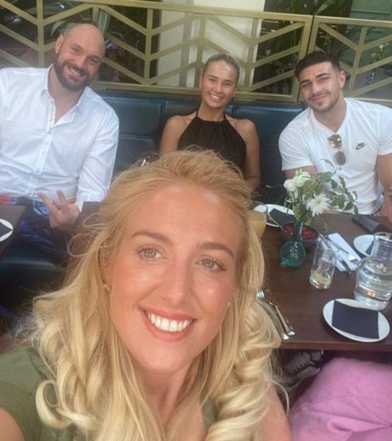 Group photo of Tyson Fury, Paris Fury, Molly Mae Hague, and Tommy Fury at a restaurant.
