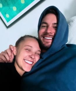 JoJo Siwa and Chris Hughes cuddling.