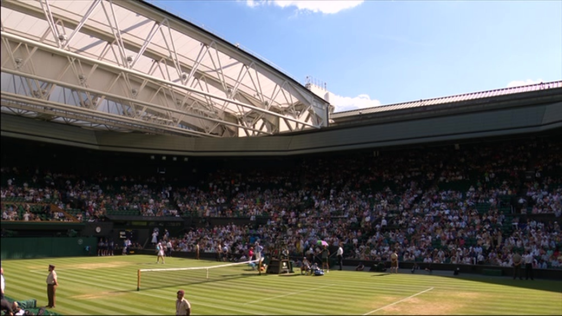Tennis match in a stadium.
