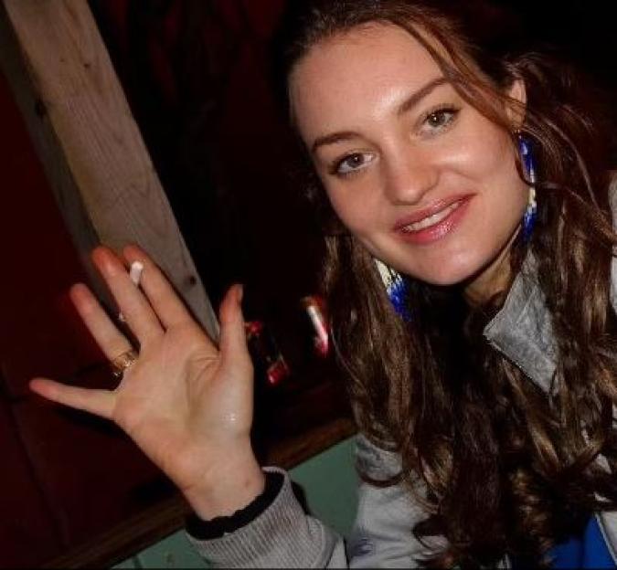 Photo of Constance Marten waving.