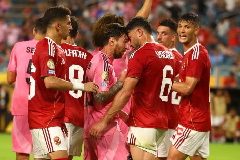 Lionel Messi of Inter Miami CF interacting with Al Ahly SC players.
