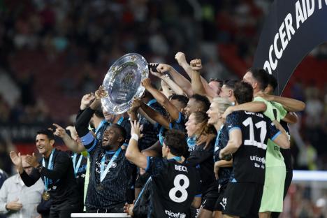 Soccer Football - Soccer Aid 2023 - Old Trafford, Manchester, Britain - June 11, 2023 Usain Bolt and teammates celebrate with the trophy after winning the Soccer Aid 2023 Action Images via Reuters/Jason Cairnduff