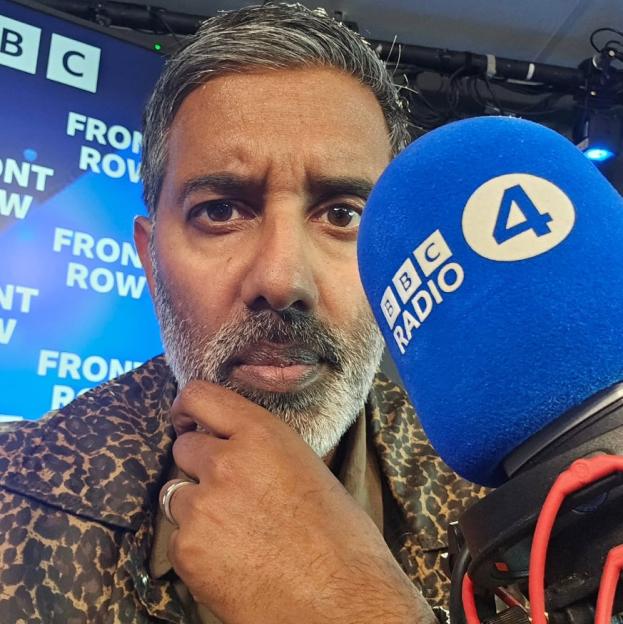 BBC Radio 4 DJ Nihal holding a microphone.